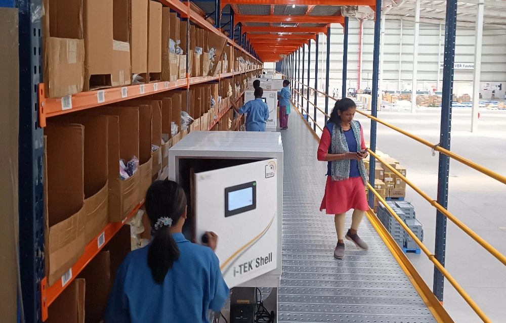 Operator using an RFID processing station in a supply chain facility