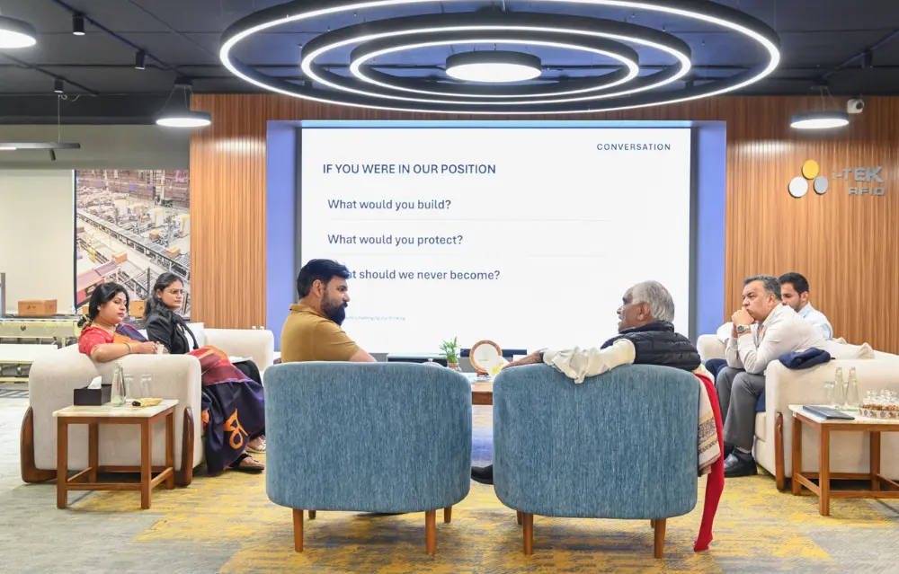 Dr. Ram Charan and the i-TEK team discussing what to build, protect and never become as the company grows.